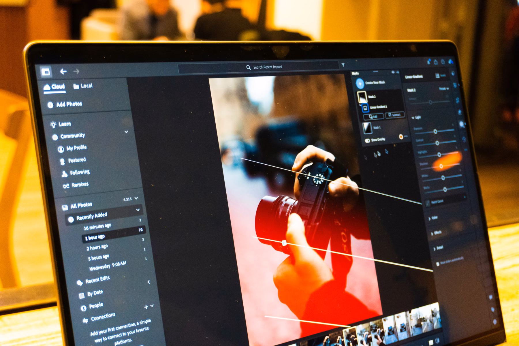 Designer using photo editing software to make an image background transparent