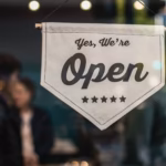 Open sign in a small business storefront window, representing LocalBusiness schema markup