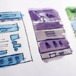 Wireframe sketches of website layouts, representing UI design planning
