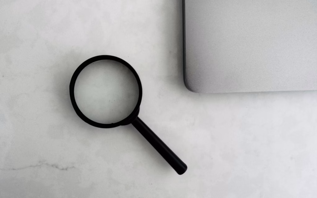 Magnifying glass on a laptop, inspecting rich results test output