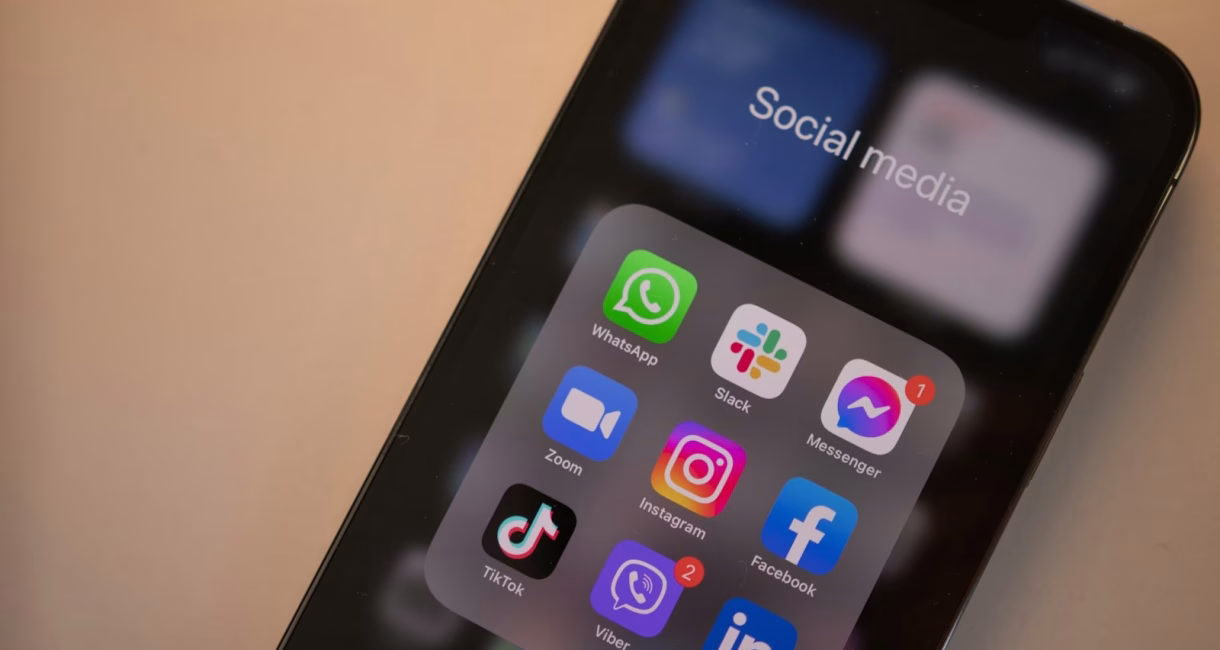 Smartphone with a social media folder of Facebook, Instagram and Messenger apps